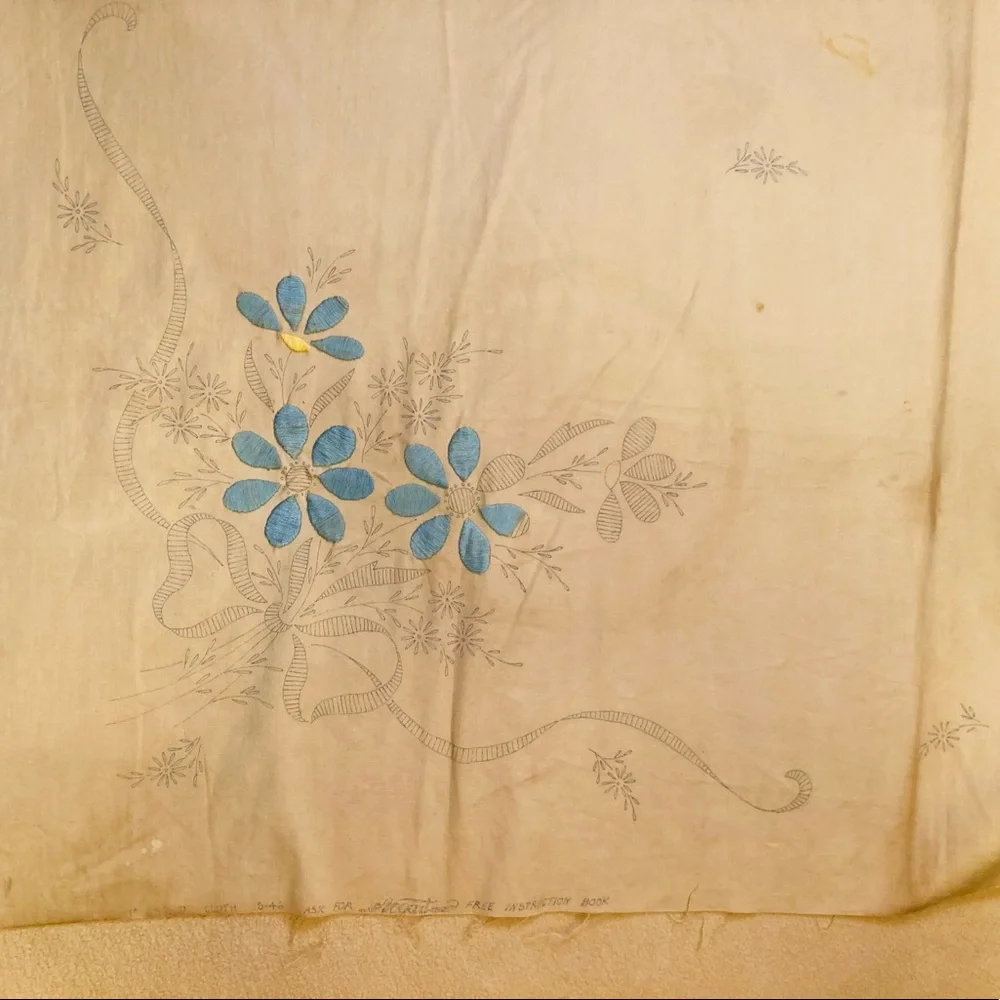Vintage embroidery muslin, three corners begun, one ink outline blue pink red